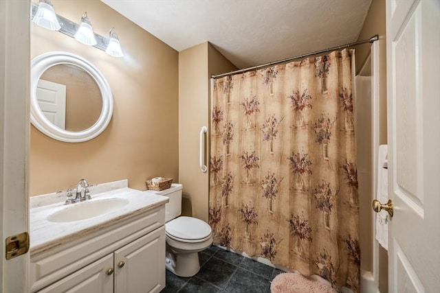 bathroom featuring vanity, curtained shower, and toilet