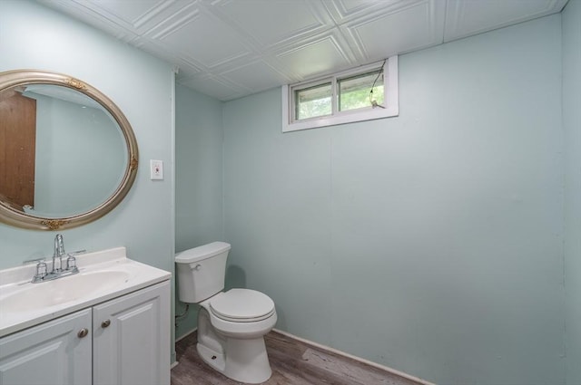 896 Montgomery St, Chicopee, MA 01013 - bathroom with wood finished floors, vanity, and toilet