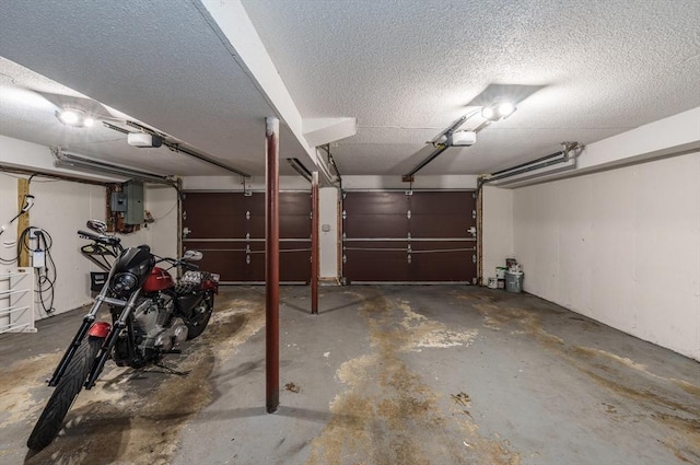896 Montgomery St, Chicopee, MA 01013 - garage with a garage door opener and electric panel