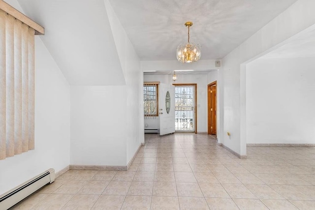 interior space featuring baseboards, a baseboard radiator, and a notable chandelier