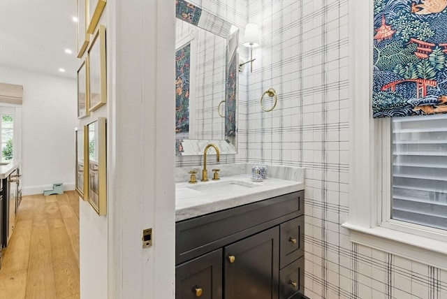 782 E 4th St, Boston, MA 02127 - bathroom featuring vanity, wood finished floors, recessed lighting, baseboards, and wallpapered walls