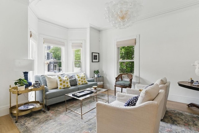 782 E 4th St, Boston, MA 02127 - living area with plenty of natural light, wood finished floors, crown molding, baseboards, and a chandelier