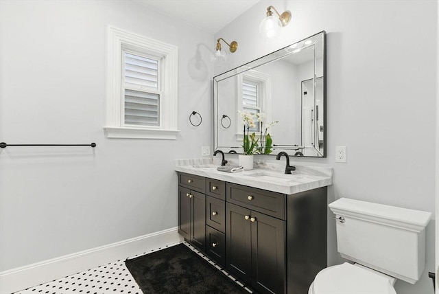 782 E 4th St, Boston, MA 02127 - full bath featuring double vanity, toilet, and baseboards