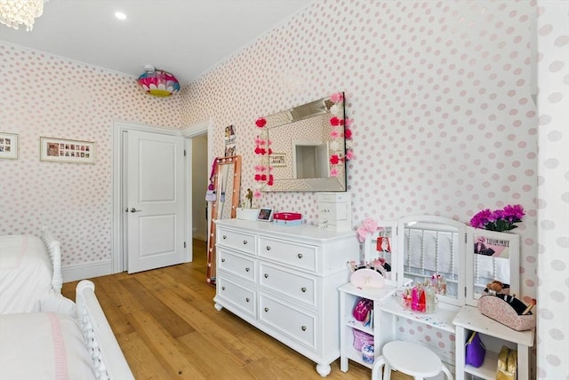 782 E 4th St, Boston, MA 02127 - bedroom with wallpapered walls, light wood finished floors, and baseboards