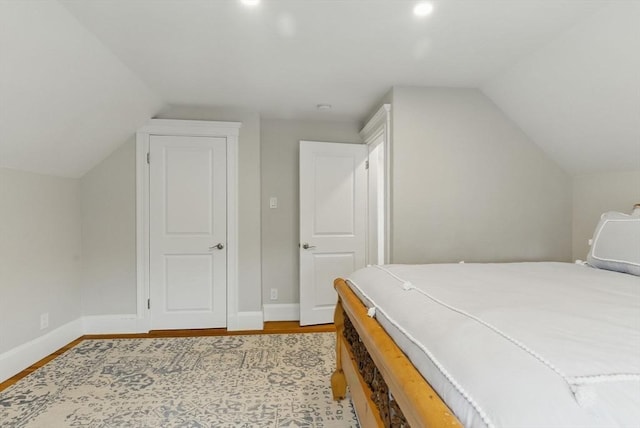 782 E 4th St, Boston, MA 02127 - bedroom with lofted ceiling, wood finished floors, and baseboards