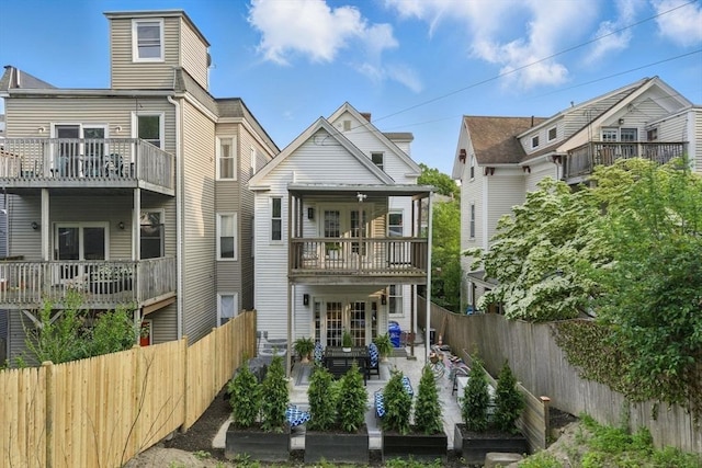 782 E 4th St, Boston, MA 02127 - back of property with a balcony, a patio area, a fenced backyard, and french doors