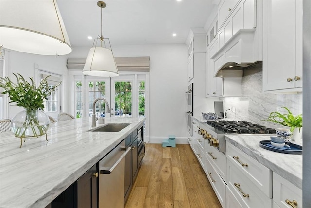 782 E 4th St, Boston, MA 02127 - kitchen featuring a sink, appliances with stainless steel finishes, recessed lighting, white cabinetry, and decorative backsplash