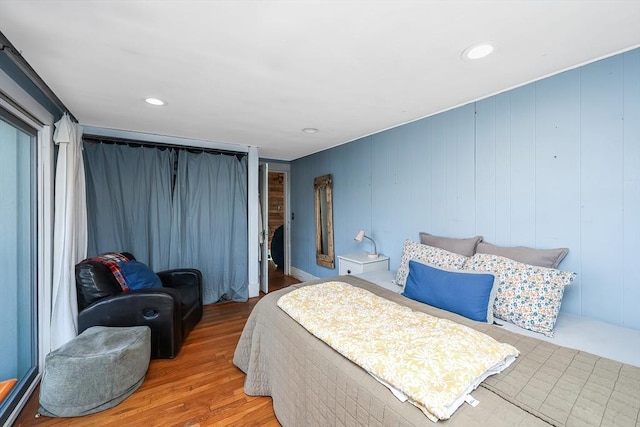 bedroom with hardwood / wood-style floors