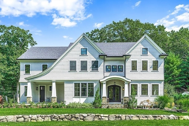 view of front of house featuring french doors and a front yard