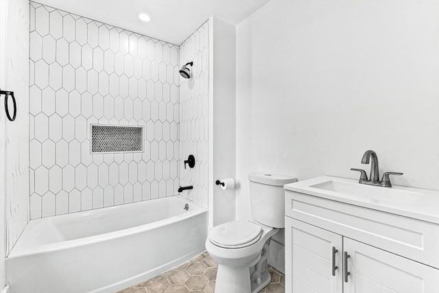 full bathroom with tiled shower / bath combo, vanity, tile patterned flooring, and toilet