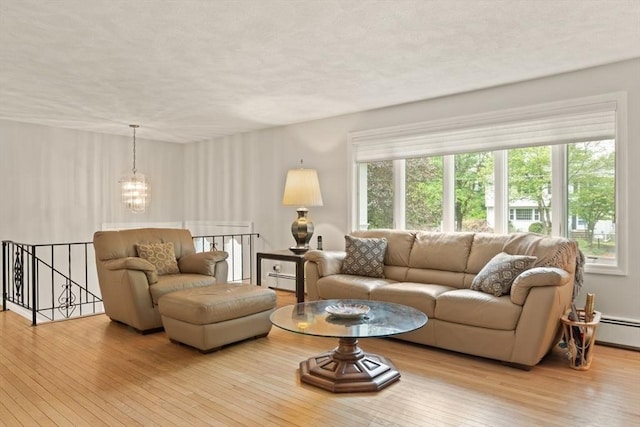 18 Sunset Dr, Sharon, MA 02067 - living room featuring plenty of natural light, hardwood / wood-style flooring, a chandelier, and a textured ceiling