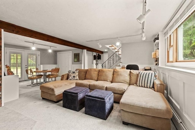 18 Sunset Dr, Sharon, MA 02067 - living area with rail lighting, a decorative wall, stairs, carpet flooring, and plenty of natural light