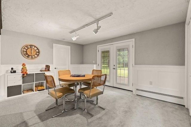 18 Sunset Dr, Sharon, MA 02067 - dining room featuring french doors, a baseboard radiator, a wainscoted wall, carpet floors, and a textured ceiling