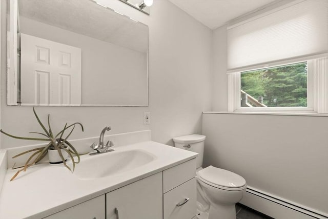 18 Sunset Dr, Sharon, MA 02067 - bathroom featuring a baseboard heating unit, vanity, and toilet