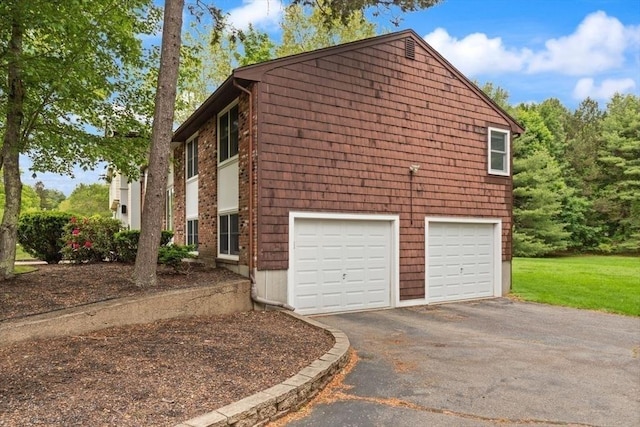 18 Sunset Dr, Sharon, MA 02067 - view of side of property with asphalt driveway and a garage