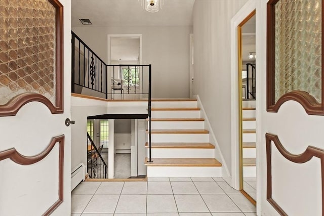18 Sunset Dr, Sharon, MA 02067 - stairs with healthy amount of natural light, baseboard heating, and tile patterned flooring