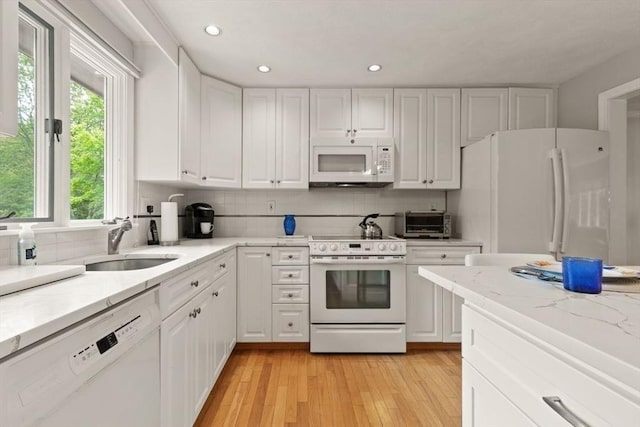 18 Sunset Dr, Sharon, MA 02067 - kitchen featuring white appliances, a sink, white cabinetry, backsplash, and recessed lighting