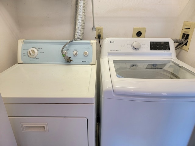 laundry area with separate washer and dryer