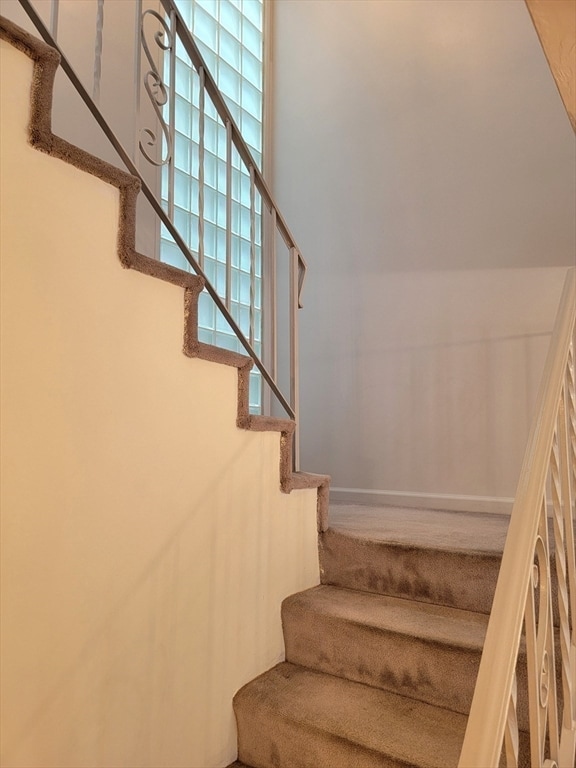 staircase with plenty of natural light