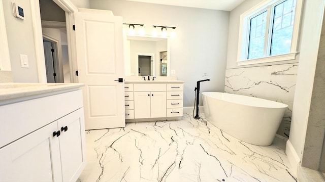 784 Main St, Hudson, MA 01749 - bathroom featuring marble finish flooring, vanity, and a freestanding bath