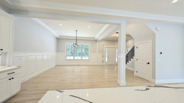 784 Main St, Hudson, MA 01749 - unfurnished dining area featuring light wood finished floors, a decorative wall, wainscoting, recessed lighting, and crown molding
