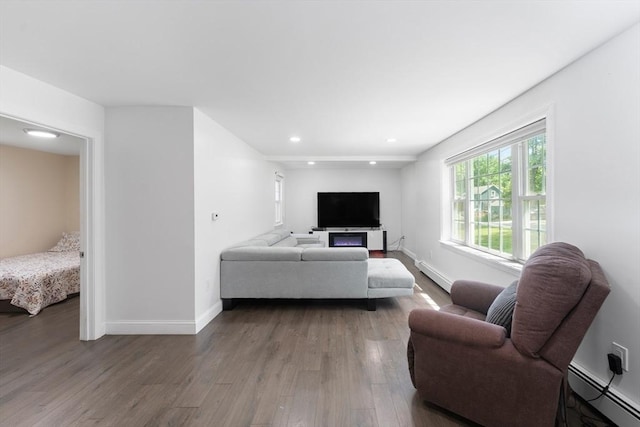 5 Woodland Dr, Oxford, MA 01540 - living area with baseboard heating, wood finished floors, and recessed lighting