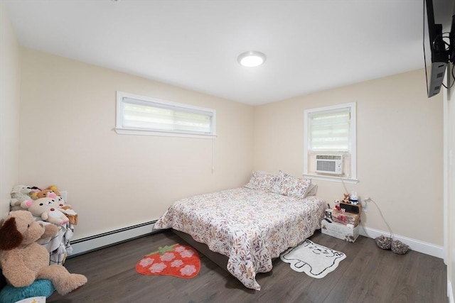 5 Woodland Dr, Oxford, MA 01540 - bedroom featuring a baseboard radiator, multiple windows, wood finished floors, and cooling unit