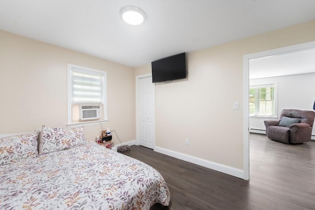 5 Woodland Dr, Oxford, MA 01540 - bedroom featuring baseboard heating, dark wood-style flooring, and cooling unit