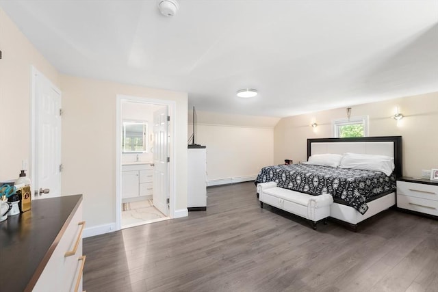 5 Woodland Dr, Oxford, MA 01540 - bedroom featuring dark wood-type flooring, baseboard heating, and connected bathroom