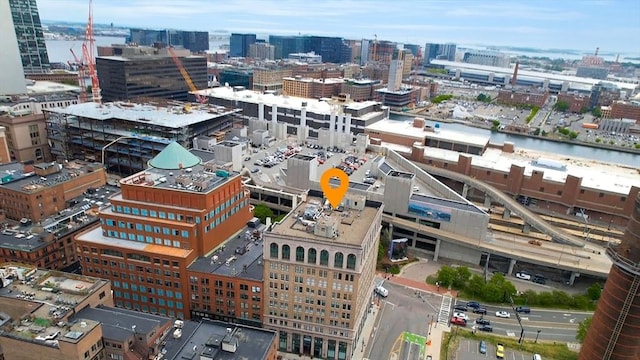 aerial view featuring a view of city and a water view