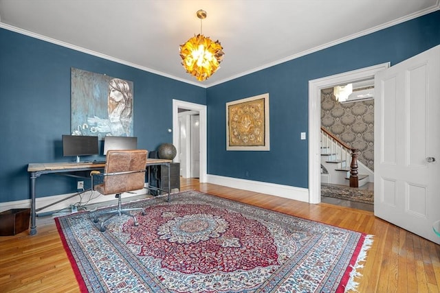 office space featuring hardwood / wood-style flooring, ornamental molding, and a notable chandelier