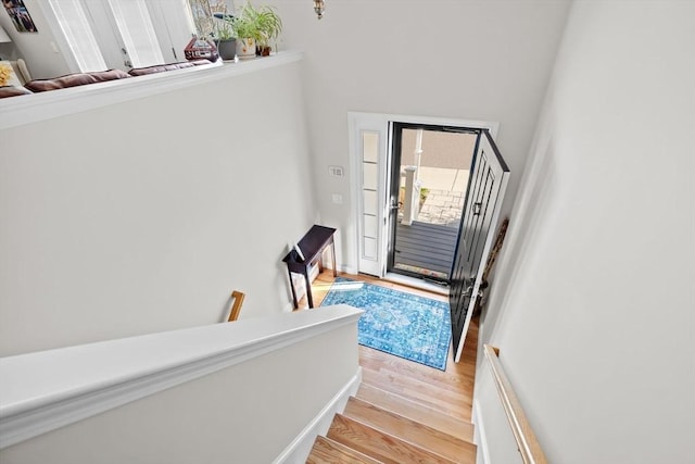 staircase featuring wood finished floors