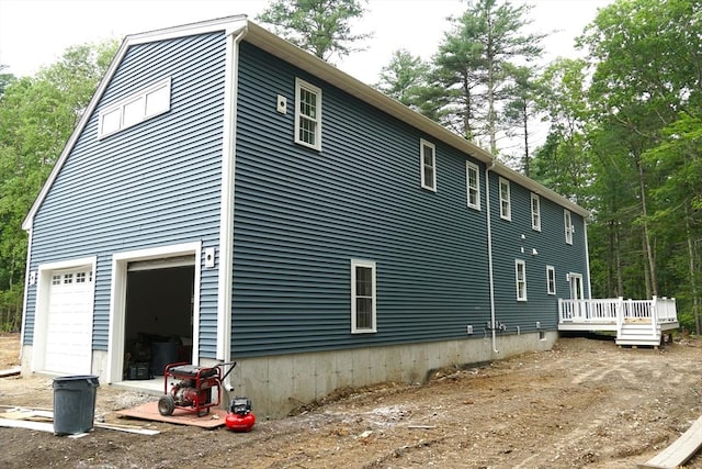 127 John Scott Blvd, Norton, MA 02766 - view of side of property with a deck and a garage