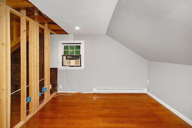 100 Main, Acton, MA 01720 - additional living space with a baseboard heating unit, lofted ceiling, wood finished floors, cooling unit, and baseboards