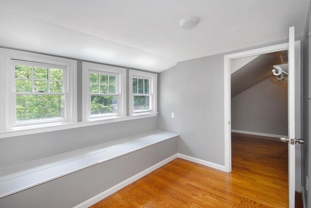100 Main, Acton, MA 01720 - hallway with light wood-style flooring, lofted ceiling, plenty of natural light, and baseboards
