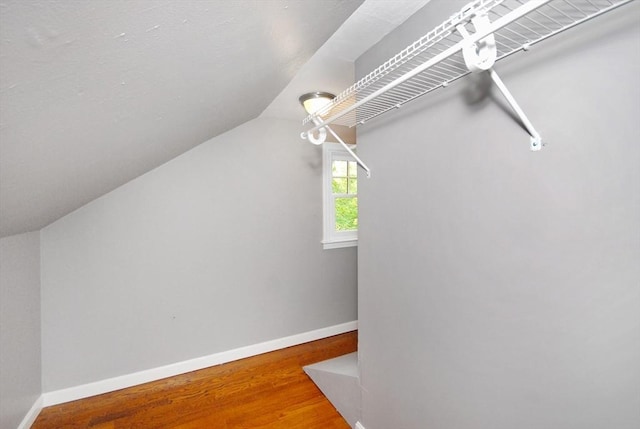 100 Main, Acton, MA 01720 - walk in closet featuring lofted ceiling and wood finished floors