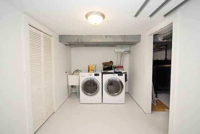 100 Main, Acton, MA 01720 - washroom featuring washer and clothes dryer, oil tank, and baseboards