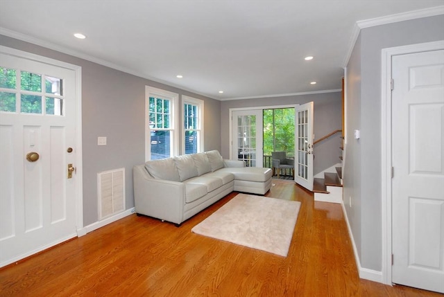100 Main, Acton, MA 01720 - living room with ornamental molding, baseboards, wood finished floors, stairway, and recessed lighting