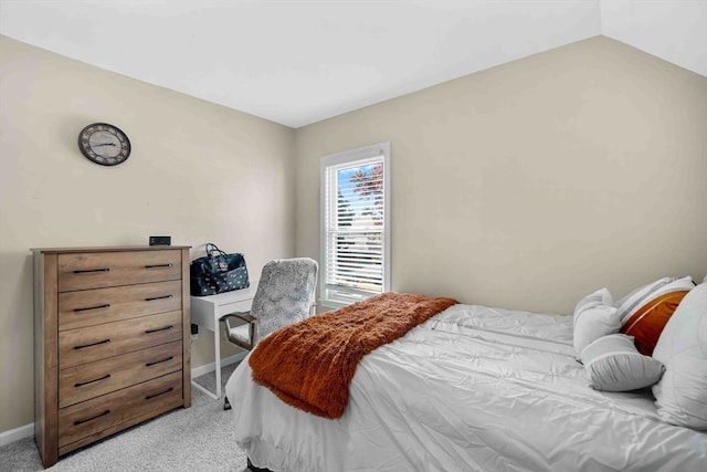 carpeted bedroom with vaulted ceiling