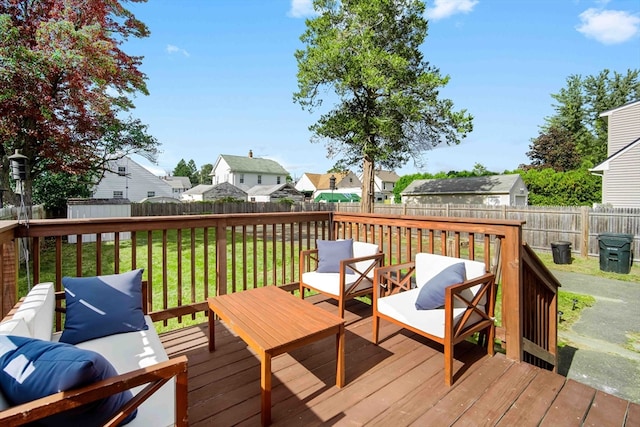 deck featuring a lawn and a storage shed