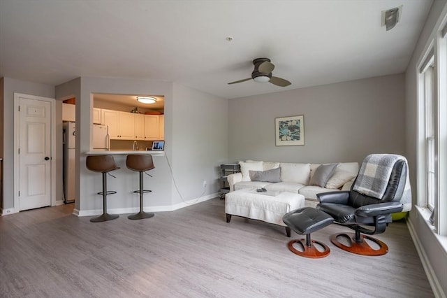 1 Riverview Blvd Unit 2-213, Methuen, MA 01844 - living area with wood finished floors, a ceiling fan, and baseboards
