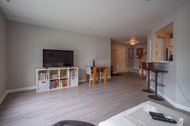 1 Riverview Blvd Unit 2-213, Methuen, MA 01844 - living room featuring baseboards, wood finished floors, and stairway