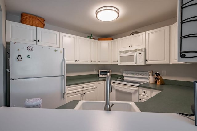 1 Riverview Blvd Unit 2-213, Methuen, MA 01844 - kitchen with white appliances, dark countertops, and white cabinets