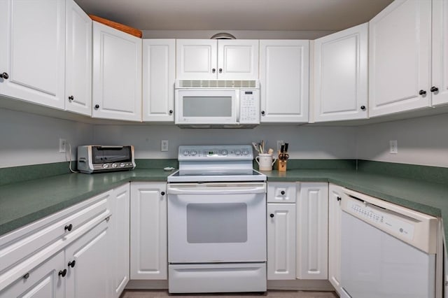 1 Riverview Blvd Unit 2-213, Methuen, MA 01844 - kitchen with white appliances, white cabinets, and dark countertops