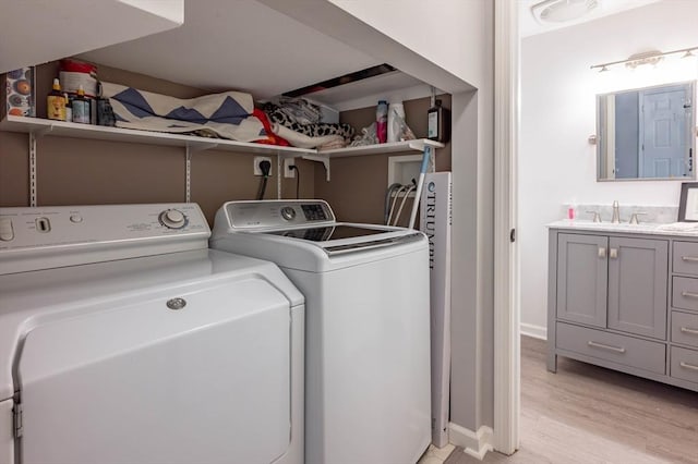 1 Riverview Blvd Unit 2-213, Methuen, MA 01844 - laundry room featuring washing machine and dryer, light wood-type flooring, and baseboards