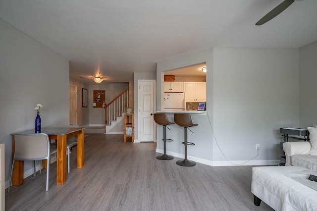 1 Riverview Blvd Unit 2-213, Methuen, MA 01844 - living room featuring light wood-style floors, stairs, baseboards, and a ceiling fan