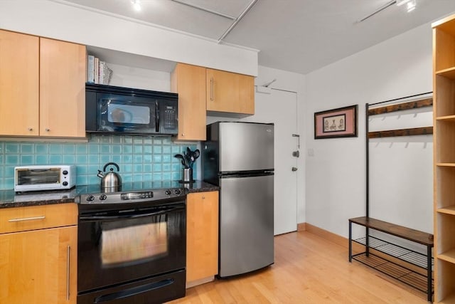 29 Concord Ave Unit 302, Cambridge, MA 02138 - kitchen featuring black appliances, open shelves, decorative backsplash, light wood-style floors, and dark stone countertops