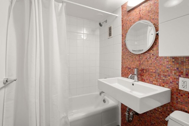 29 Concord Ave Unit 302, Cambridge, MA 02138 - full bathroom with tile walls, toilet, shower / bathtub combination with curtain, a sink, and tasteful backsplash