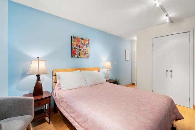 29 Concord Ave Unit 302, Cambridge, MA 02138 - bedroom featuring light wood-style flooring, a closet, and track lighting