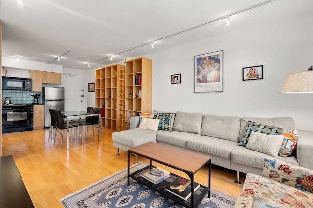 29 Concord Ave Unit 302, Cambridge, MA 02138 - living area with rail lighting and light wood finished floors